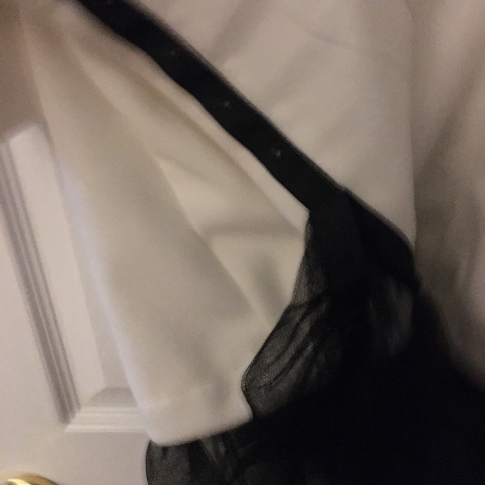 White coat. Black lace at the bottom optional.